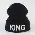 Detailed white KING embroidery on the cuff of a black knitted winter beanie hat - Adjustable / Black White King