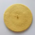 Top-down view of yellow wool felt beret showing smooth texture and classic top stalk - One Size / Yellow