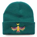 Deep green knit beanie with detailed colorful bird and crescent moon embroidery on front - One Size / Dark Green