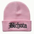Detailed close-up of pink knit beanie with black Bichota gothic embroidery - Adjustable / Pink