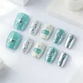 Muntgroene kunstnagels met 3D zilveren zeesterren en glitter op een witte achtergrond - Muntgroen 3D Zeester Stijl (SGL0079)
