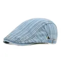 Dettaglio della fibbia regolabile in ottone sulla coppola in denim a righe azzurre - Regolabile / Azzurro