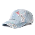 Berretto da baseball in denim lavato azzurro con stampe floreali e visiera curva per donna - Regolabile / Blu e Bianco