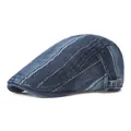 Close-up of vintage washed denim flat cap with striped stitching and metal side buckle - Adjustable / Dark Blue