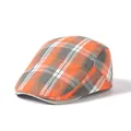 Detailed close-up of the orange and grey plaid pattern on this cotton flat cap - Adjustable / Orange