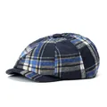 Close-up of blue and yellow plaid newsboy hat showing fine wool texture and stitch details - One Size / Navy Blue