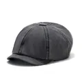 Detailed close-up of dark charcoal washed cotton newsboy cap with eight-panel stitching - One Size / Black