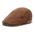 Detail view of brown knit ivy cap with textured ridges and leather adjustable back strap - Coffee