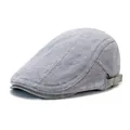 Men's grey vintage newsboy cap with striped fabric and leather brim in a side profile view - Gray