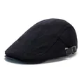 Detail of black vintage flat cap showing ribbed fabric texture and leather brim finish - Black