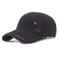 Detail of black cotton baseball cap showing GSIOR embroidery and metal maple leaf badge - Adjustable / Black