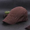 Quilted brown cotton beret for men and women featuring vintage metal brand plate - Adjustable / Coffee