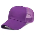 Unisex purple trucker hat featuring breathable mesh panels and a solid curved brim - Purple