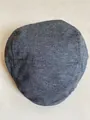Flat lay of dark grey wool blend newsboy cap with classic knitted texture and stitching - Plain / Dark Gray