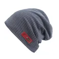 Dark grey striped knit beanie featuring a leather patch and fishbone metal charm - One Size / Navy Blue