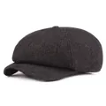 Detail of grey herringbone tweed fabric texture on a vintage British newsboy cap - One Size / Black