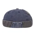 Detail of vintage washed docker hat showing navy and grey patchwork with raw edge texture - Adjustable / Navy Blue