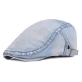 Detail of light blue washed denim flat cap showing metal buckle and fabric texture - Adjustable / Light Blue