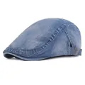 Close-up of light blue washed denim flat cap with adjustable metal side buckle - Adjustable / Blue