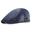 Close-up of washed denim flat cap showing metal buckle and retro texture detail - Adjustable / Dark Blue