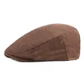 Detailed view of brown herringbone flat cap fabric with metal logo plate detail - M (56-58cm) / Khaki
