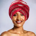 Detail of red velvet turban featuring intricate gold beadwork and rhinestones for women - Red