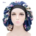Adjustable satin hair bonnet in blue floral print with wide black elastic band for sleeping - One Size / Navy Blue