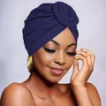 Detail of navy blue turban hat featuring a side spiral flower knot decoration - Navy Blue