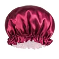 Detailed view of smooth wine red satin fabric and elastic pleated edge of the sleep cap - Burgundy