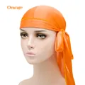 Silk-textured orange durag headwrap with long tail showing smooth glossy finish - One Size / Orange