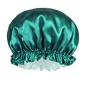 Close-up of dark green satin hair bonnet with elastic lace edge and grey lining - Aqua Blue