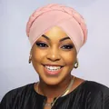 Close-up of pink braided turban hat showing soft elastic fabric texture and twist detail - Pink