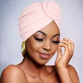 Close-up of pink turban hat featuring a detailed rose knot and soft velvet texture - Pink