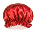 Detail of red satin sleep cap featuring elastic ruffle band and glossy silk-like texture - Red
