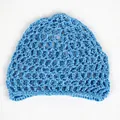 Detailed close-up of sky blue mesh knit hair net with hollow grid pattern and reinforced edge - Light Blue