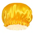 Detailed close-up of yellow satin hair bonnet with ruffled edges and elastic band texture - Yellow