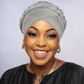 Close-up of the braided detail and soft textured knit fabric on this grey turban cap - Light Gray
