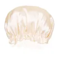 Detail of champagne satin hair bonnet showing the elastic lace edge and silky texture - Beige