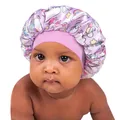Satin baby bonnet featuring purple unicorn and rainbow prints with pink elastic band - Light Purple