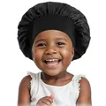 Kids black satin sleep bonnet with wide elastic band worn by a smiling child model - One Size / Black