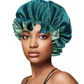 Close-up of dual-layer satin bonnet with emerald green exterior and mint ruffled edge - 30cm / Dark Green And Lake Blue