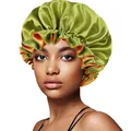 Detail of green and orange reversible satin sleep cap with ruffled elastic band edges - 30cm / Grass Green And Orange