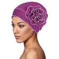 Detailed side view of dark purple turban hat with a large multilayer fabric flower decoration - One Size / Purple