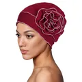 Detail of burgundy turban cap featuring a large 3D floral accent with pink stitched edges - One Size / Burgundy