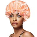 Close-up of coral satin hair bonnet featuring elastic wide band and ruffled edge details - 30cm / Solid Ivory