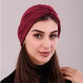 Detailed close-up of dark red twisted turban hat showing elastic jersey fabric texture - One Size / Burgundy