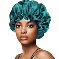 Detailed view of elastic ruffled edge and smooth satin fabric on dark green sleep bonnet - 30cm / Solid Dark Green