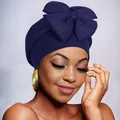Elegant navy blue turban headwrap for women featuring a large decorative bow on top - Navy Blue