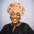 Close-up of beige turban with braided gold metallic accents and ribbed fabric texture - One Size / Khaki