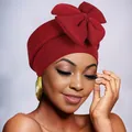 Detailed close-up of the large bow design and knit texture on the burgundy fashion turban - Burgundy